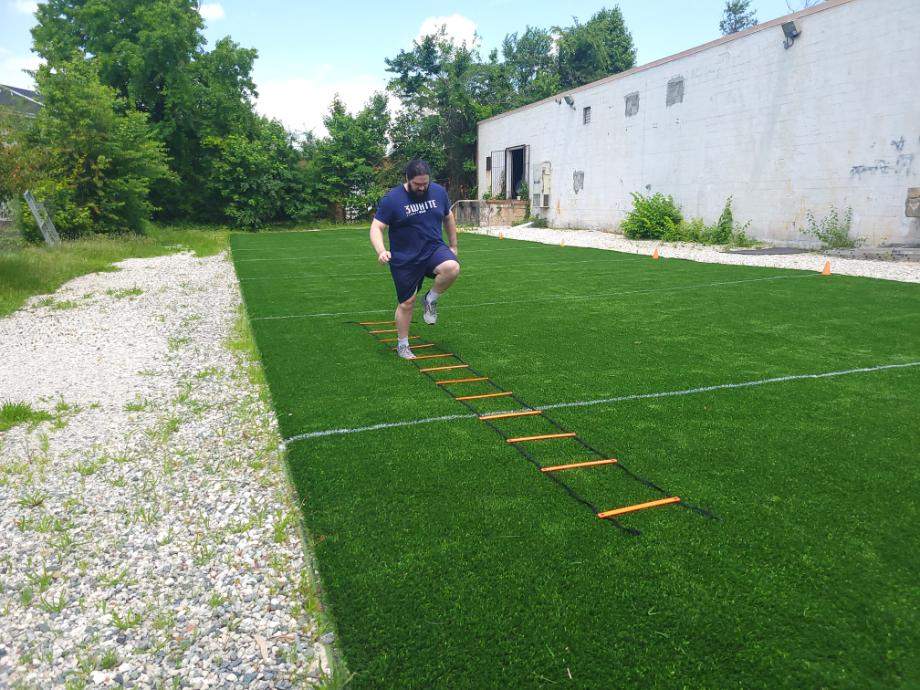 Olympian Caine Wilkes tests his footwork with the GHB Pro Agility Ladder.