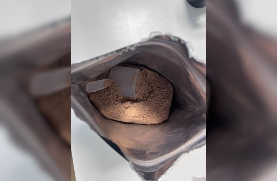 Looking down into a bag of Sports Research Whey Protein Isolate.