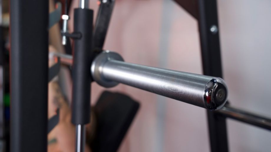 A close look at the bar end cap and sleeve from a Titan Smith Machine.