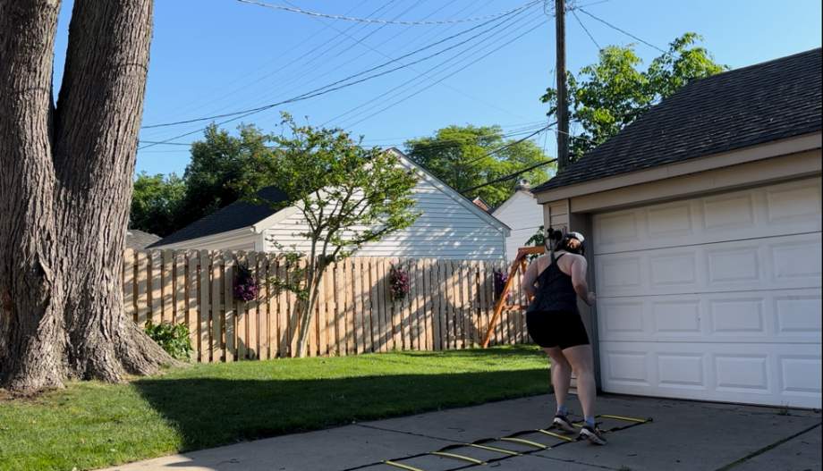 Woman using the Yes4All Agility Ladder.