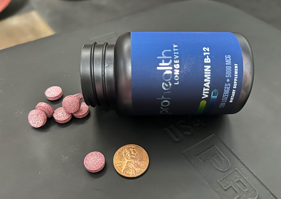 bottle-of-prohealth-b-12-with-lozenges-next-to-penny