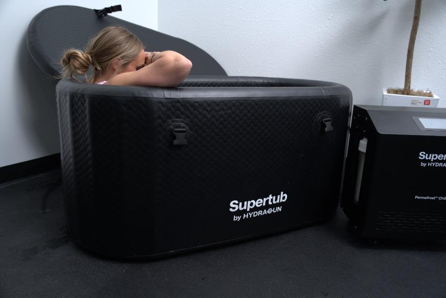 Side view of the tub in use with the logo prominently on display.