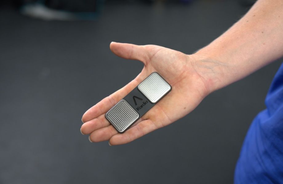 Person holding Kardia-Mobile heart rate monitor
