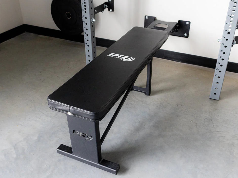 A PRx Folding Flat Bench in a gym