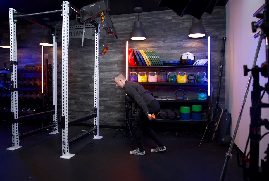 Man using Torque Relentless Ripper ski machine with a split stance