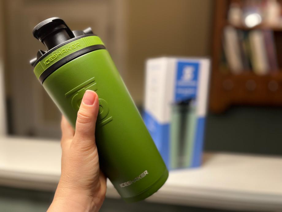 A person holds the Ice Shaker Bottle for the best shaker bottles cover image