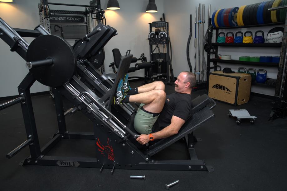 Coop doing a leg press on the Bolt Fitness Hack Squat Leg Press