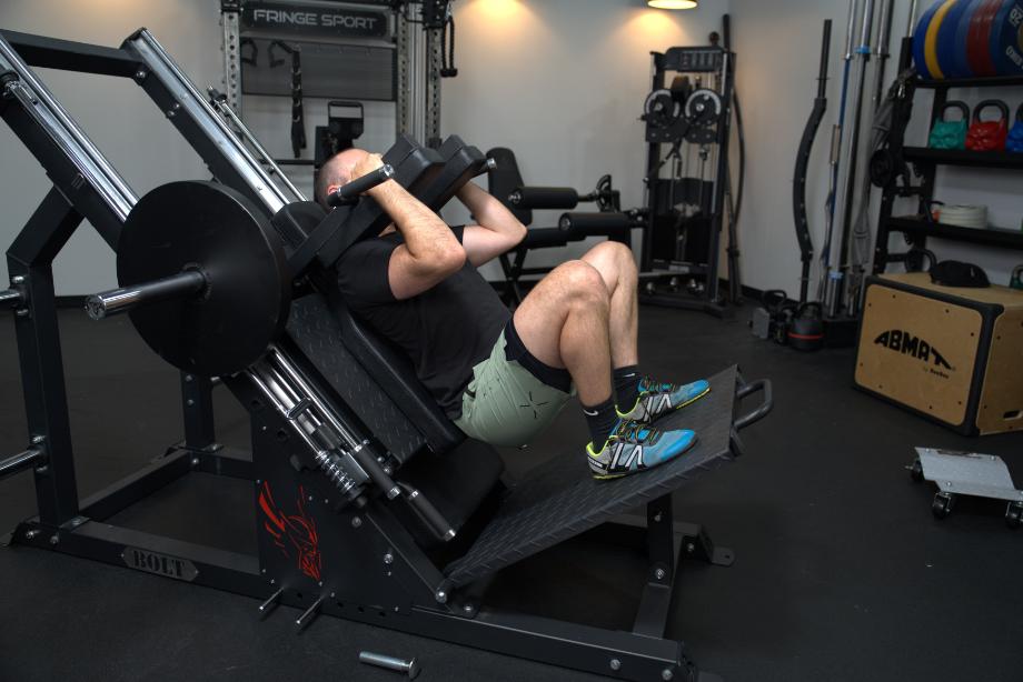 Coop squatting on a Bolt Fitness Hack Squat Leg Press
