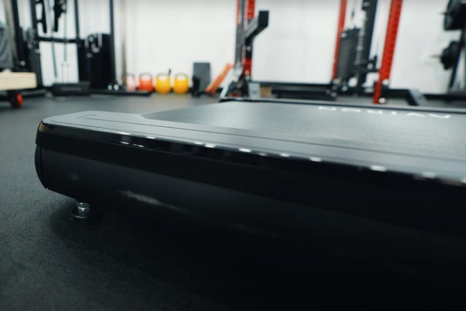 A close look at the low-profile deck height on an Aviron Victory Treadmill.