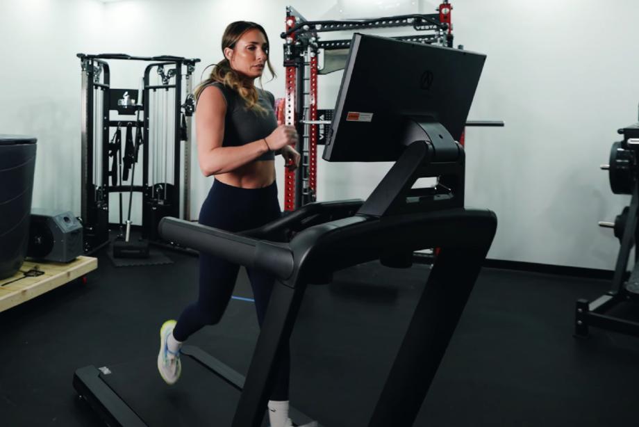 Lindsay Scheele, CPT running on an Aviron Victory Treadmill
