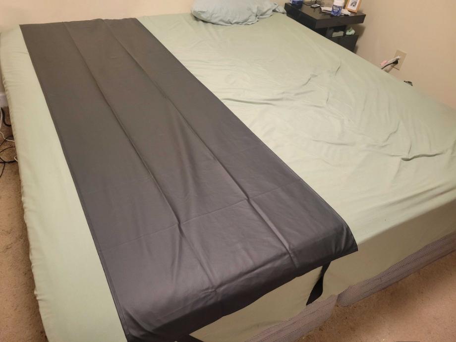 Earthing Elite Sleep Mat on a mattress