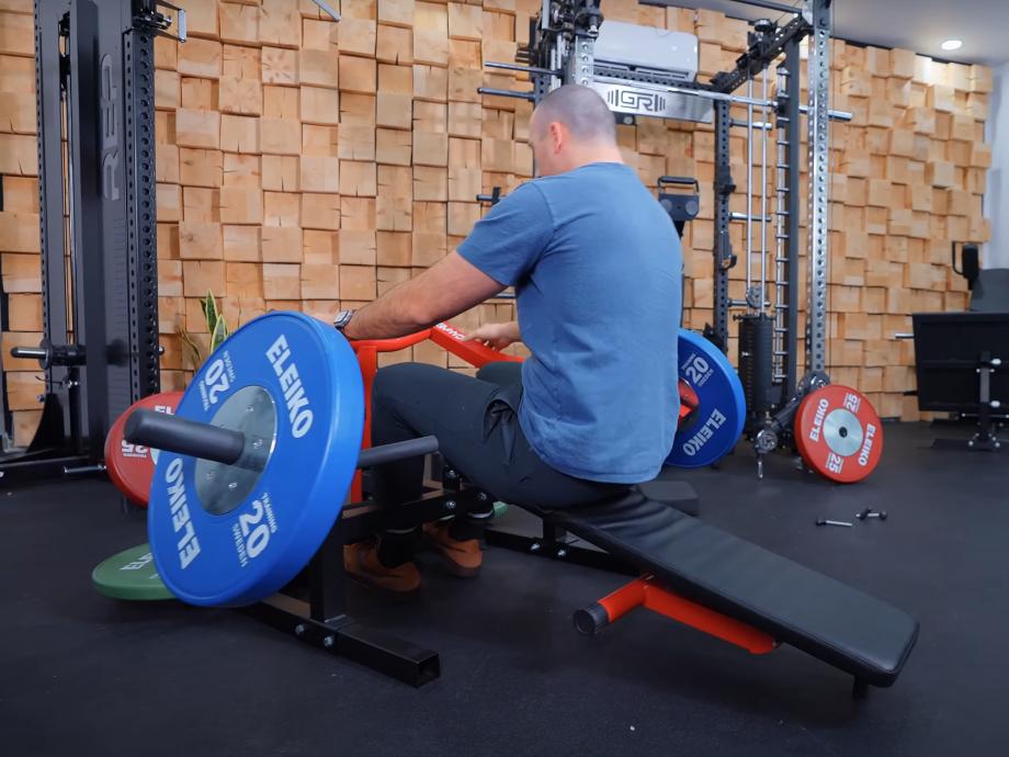 Coop uses the GMWD Bench Press Machine to do sit ups at a declination.
