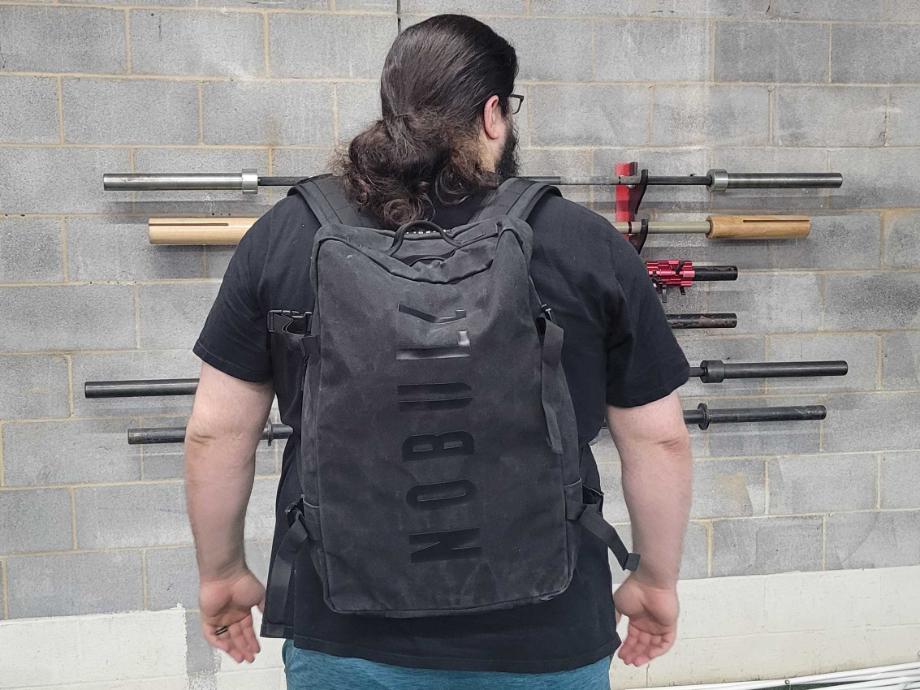 Olympian Caine WIlkes models the NOBULL Waxed Canvas Duffleback