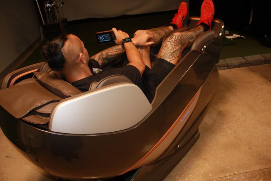 Stephen Sheehan, CPT, CNC reclines in a Costway Therapy 22 Massage Chair.