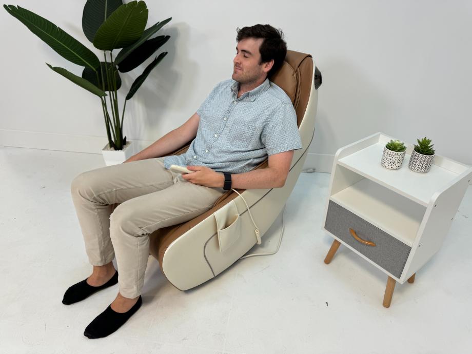A man relaxes while using a Synca Wellness CirC Massage Chair.