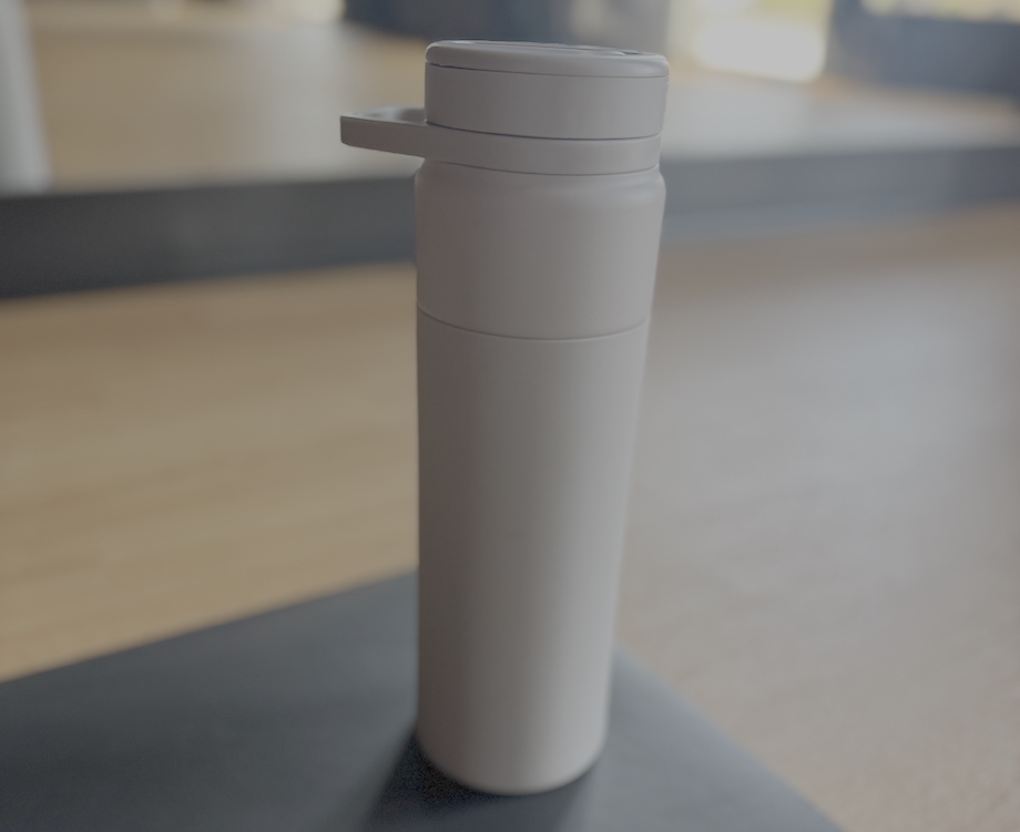 BrüMate Rotera water bottle on a yoga mat