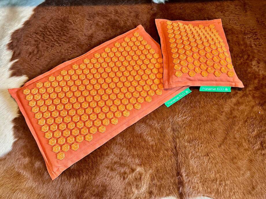 A Pranamat Accupressure Mat and Pillow Set.