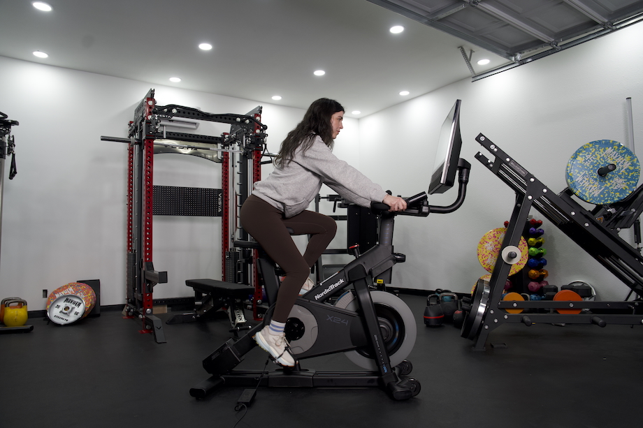 Woman riding the NordicTrack X24 exercise bike