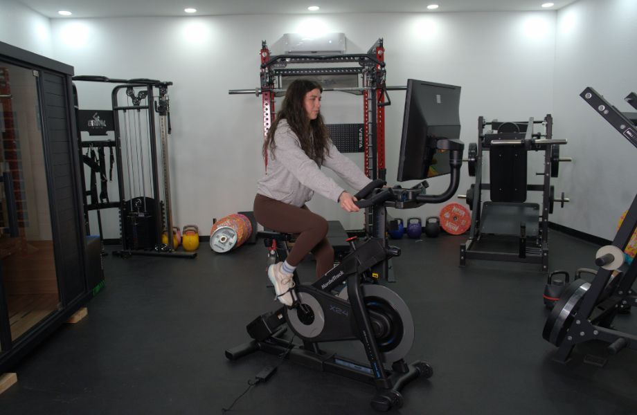 Woman riding the NordicTrack X24 bike