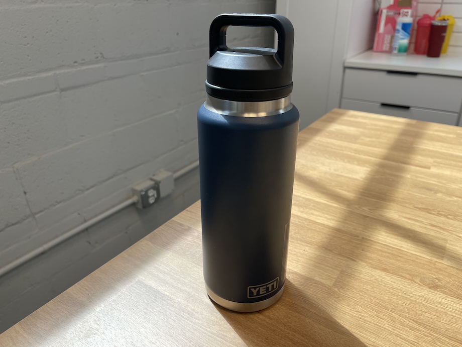 Yeti Rambler 36 oz water bottle on a wooden countertop