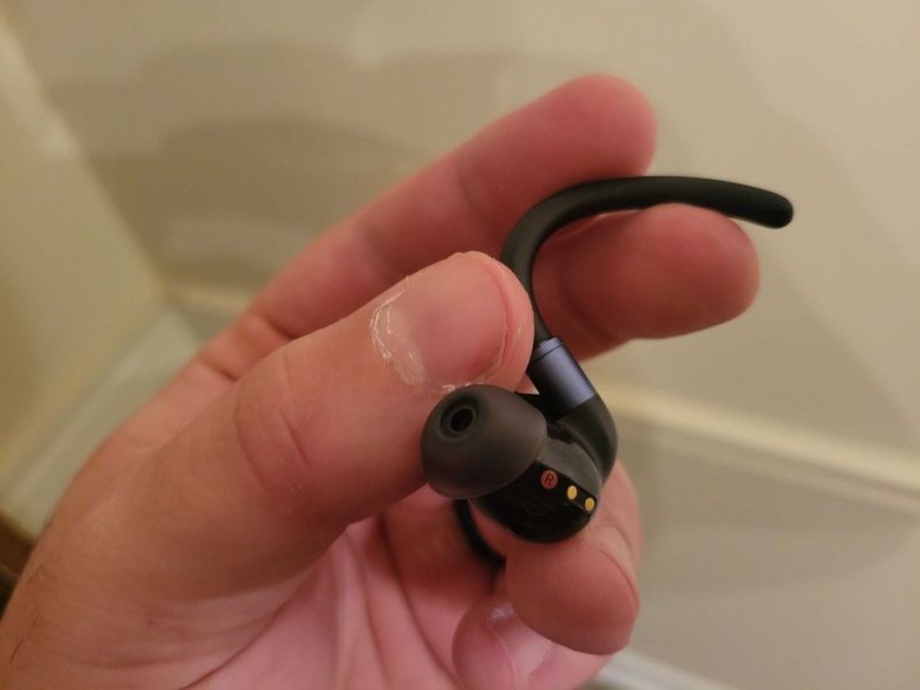 A close look at a hand holding an Anker Soundcore Sport X20.