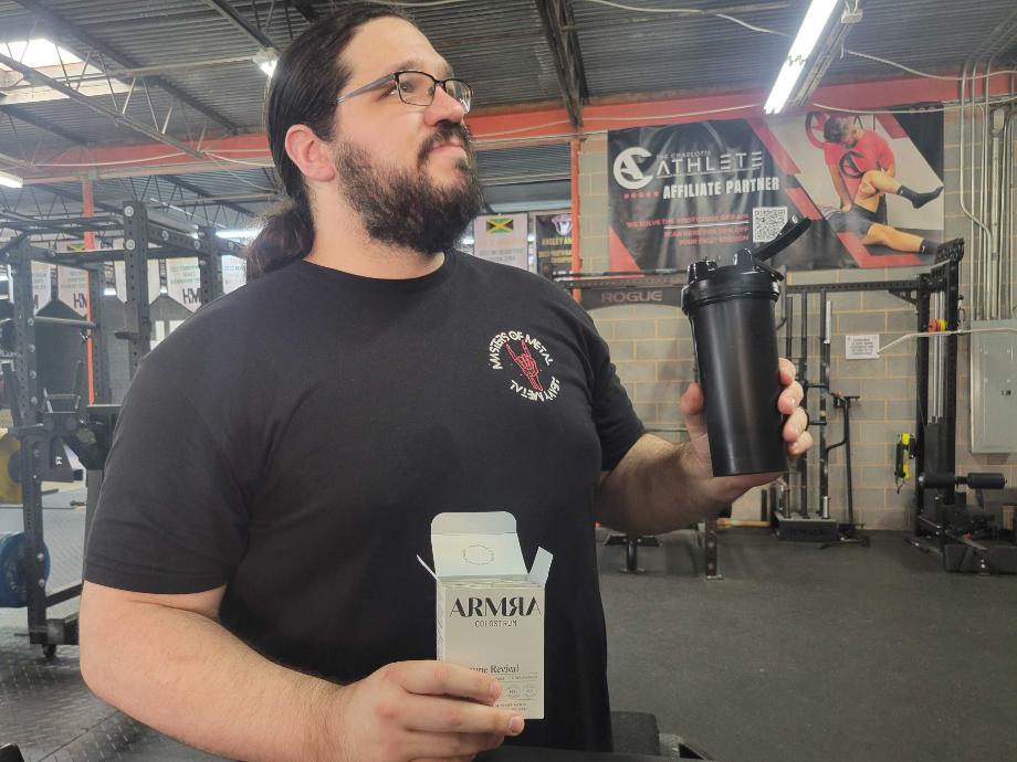 Man tasting ARMRA mixed with water