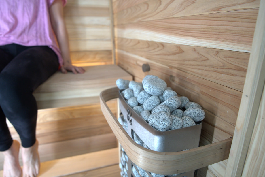 Basket of hot stones in a Plunge The Sauna Mini
