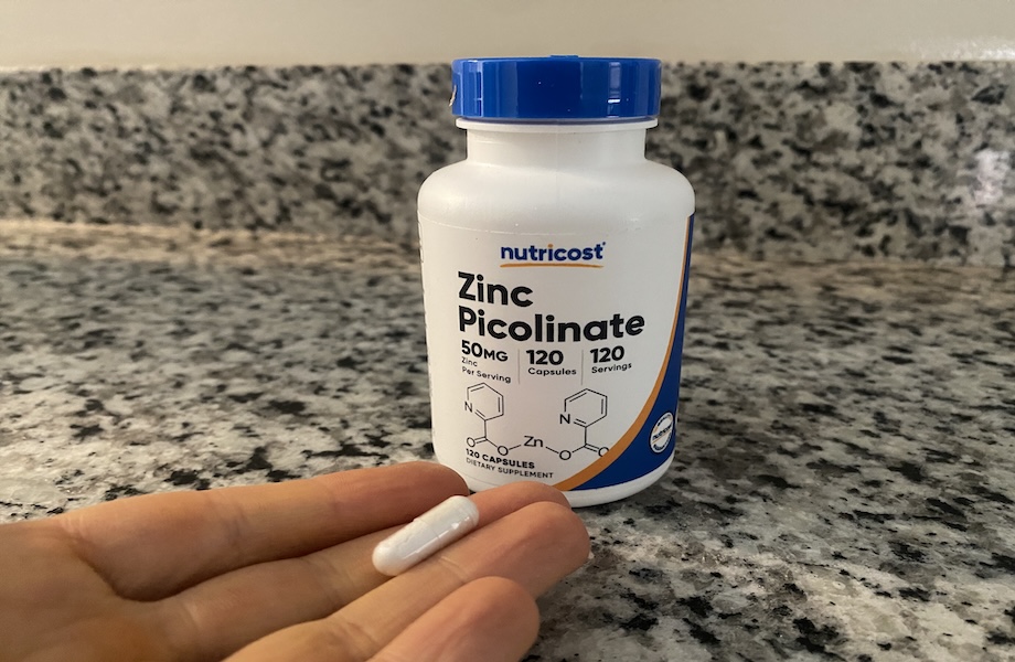 Our tester holding a capsule of Nutricost Zinc Picolinate