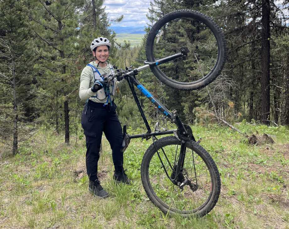 Amanda Capritto poses in the forest with an upright Marin Bobcat Trail 3