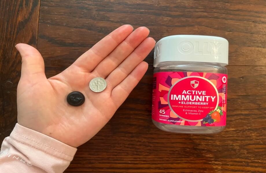 Our tester comparing the size of Olly Active Immunity gummies to a standard dime