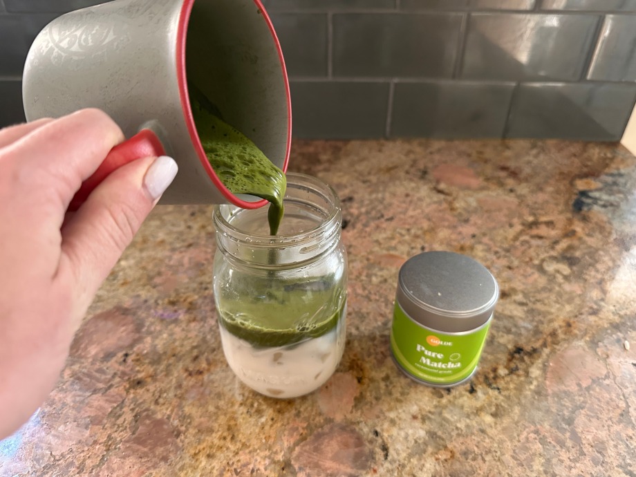 Our tester pouring a cup of Golde Pure Matcha