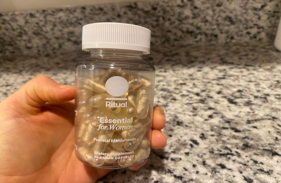 Our tester holding a container of Ritual Prenatal Multivitamin