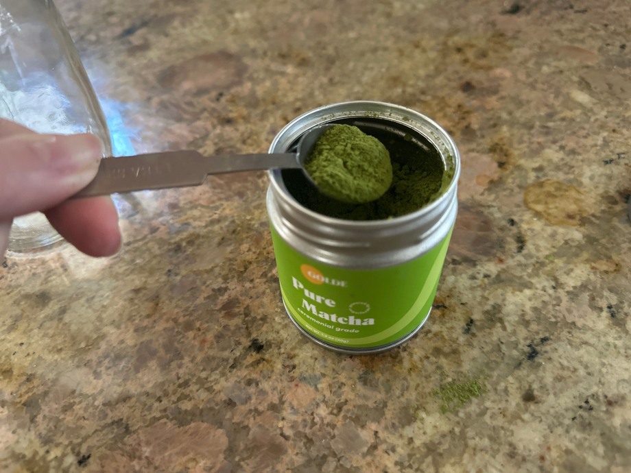 Our tester scooping from a tin of Golde Pure Matcha