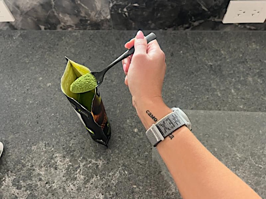 Our tester scooping some Tealyra Matcha Powder