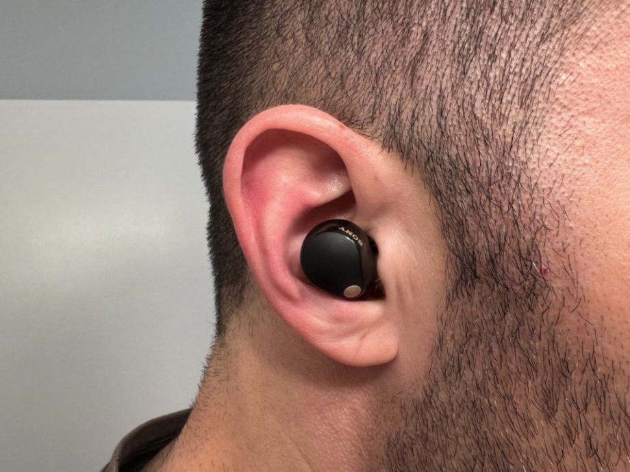 A close look at a Sony WF-1000XM5 wireless earbud being used by our product tester.