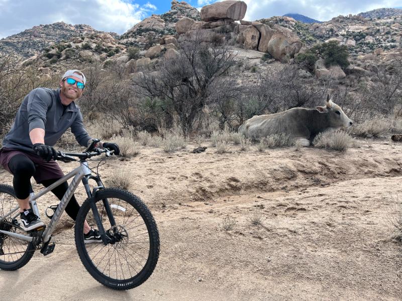Our tester hitting the trails on a Specialized Rockhopper Sport
