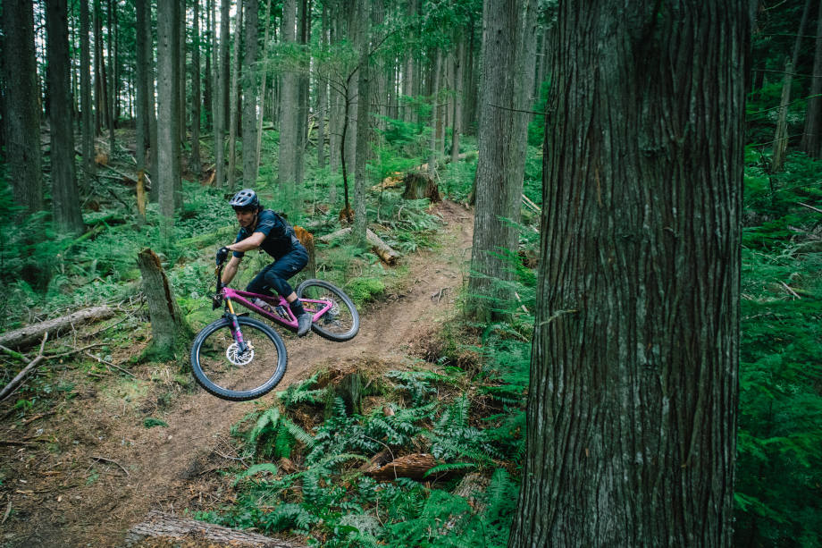 Luke Burgess rides downhill trails in the redwood forest