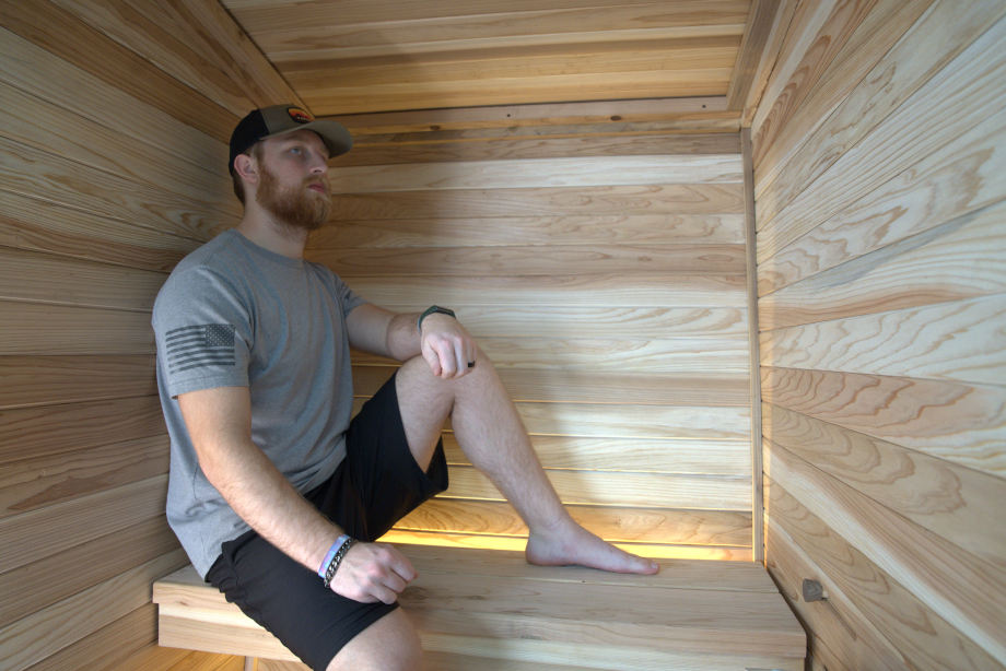 Our tester Tristan sitting in a Plunge The Sauna Mini