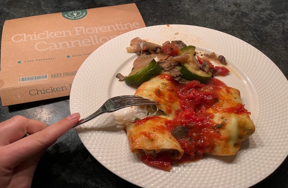 Our tester showcasing a cooked portion of Chicken Florentine Cannelloni from BistroMD
