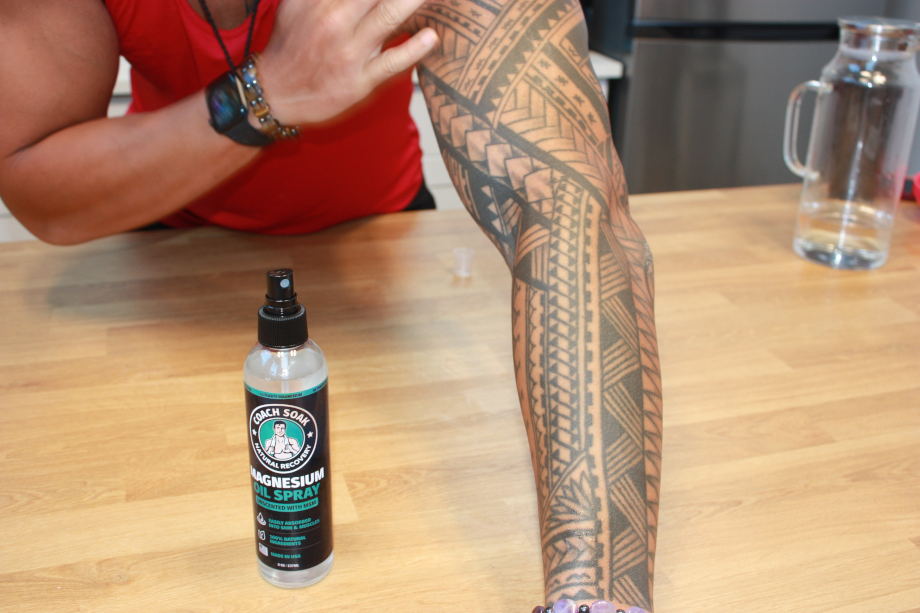 Our tester shows off his arm after applying Coach Soak Magnesium Oil Spray