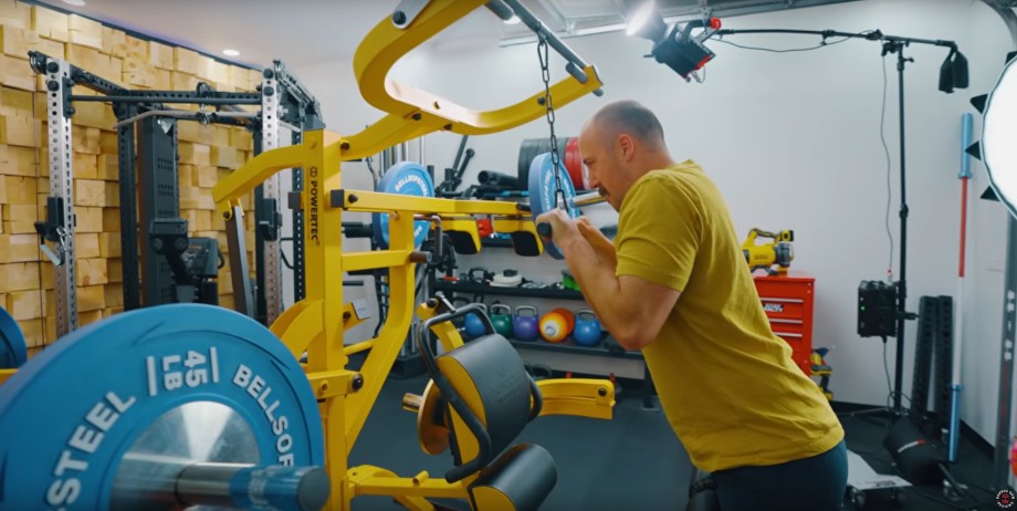 Garage Gym Reviews founder Coop Mitchell using a Powertec Workbench Multistation