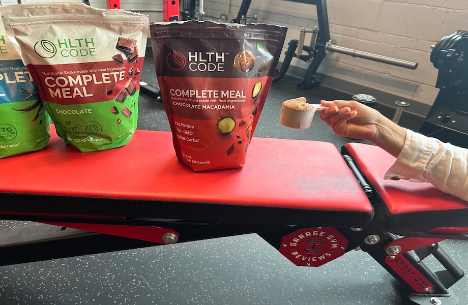 Our tester holding a full scoop of HLTH Code Complete Meal