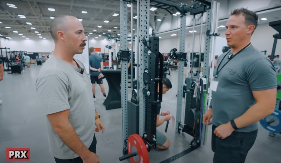 Coop talks to the PRx representative at Home Gym Con