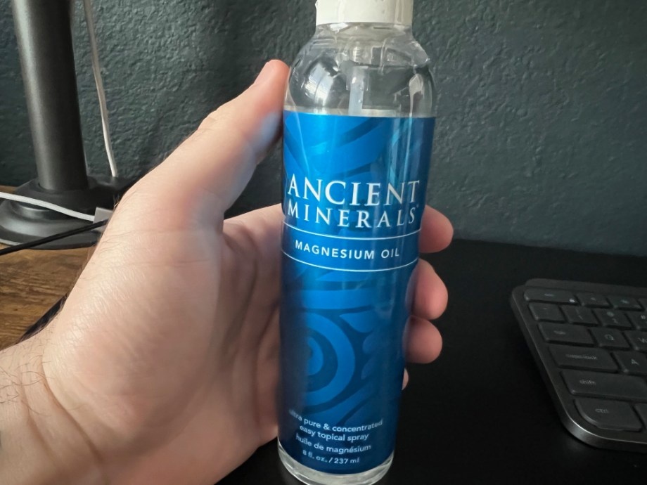 Person holding Ancient Minerals Magnesium Oil