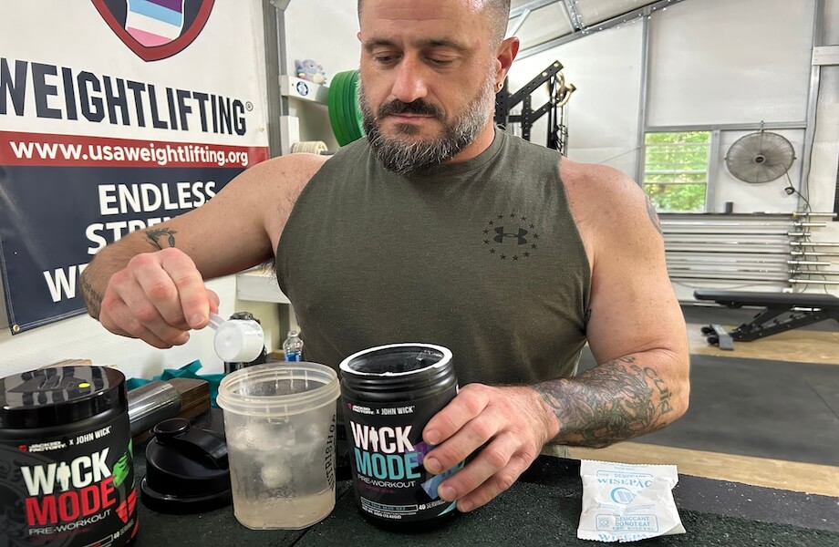 Our tester measuring out a scoop of Jacked Factory Wick Mode pre-workout prior to training