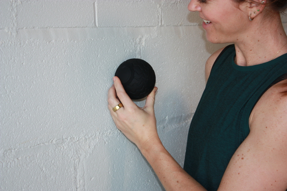 Our tester holding up the Therabody Wave Solo massage ball
