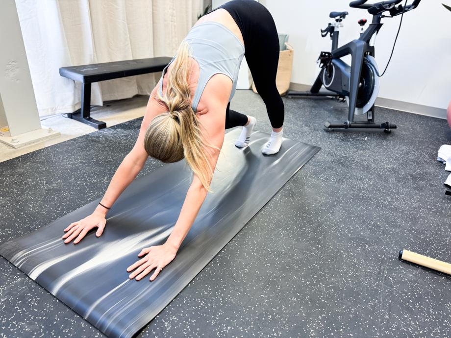 Our tester doing yoga on a lululemon The Mat