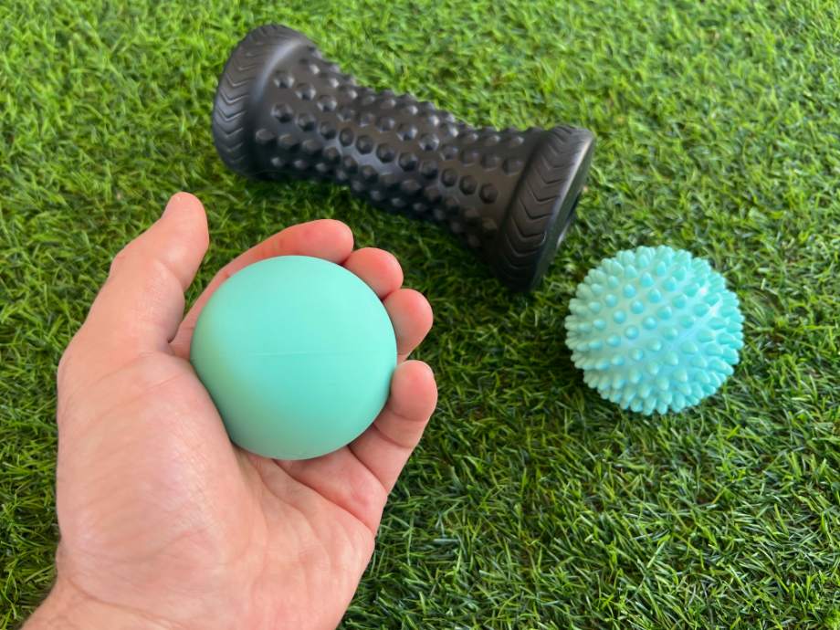 The Tumaz Massage set, with our tester holding the lacrosse ball