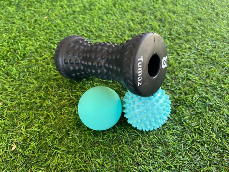 The Tumaz Massage Set resting in grass