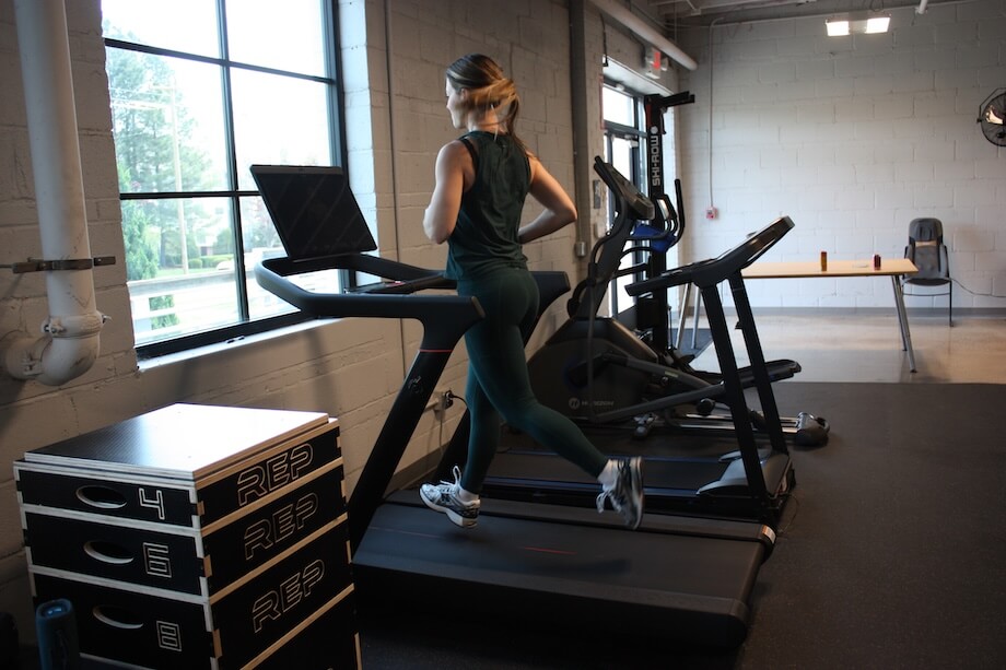 A product tester jogging on the Peloton Tread